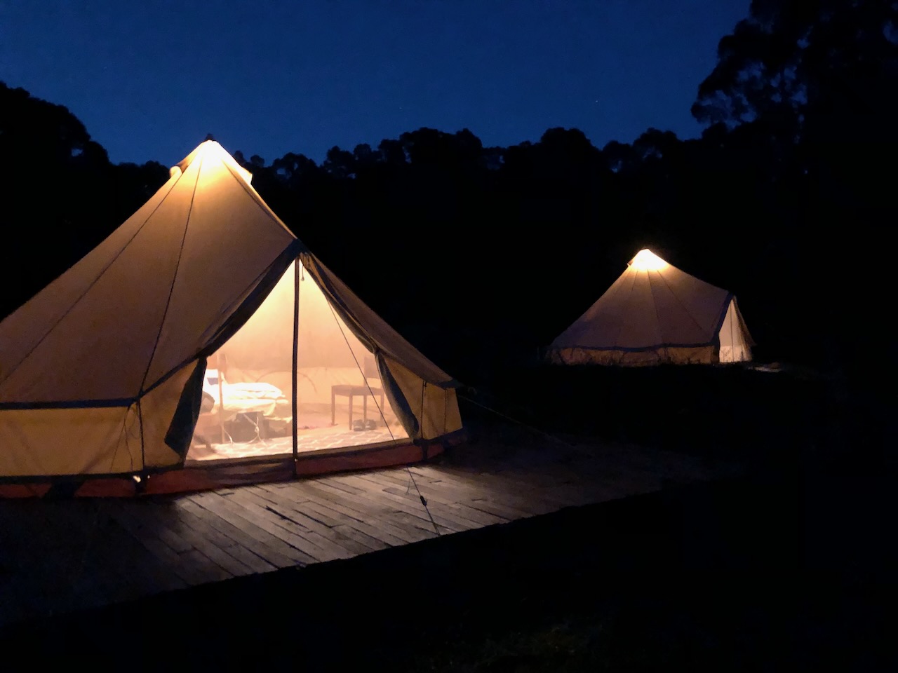 Glamping tents at night